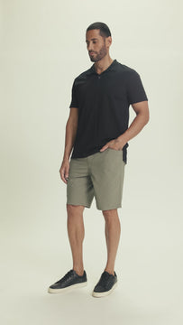 Video of model wearing LENNON relaxed fit light olive short with elastic waistband and straight leg, highlighting comfort and casual movement.